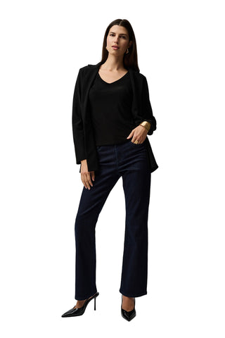Woman wearing a black outfit with a white background