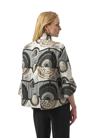 Woman wearing a patterned jacket on a white background
