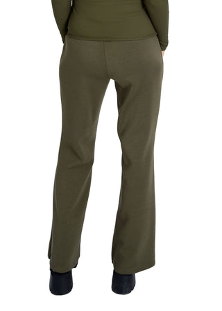Green pants worn by a person on a white background