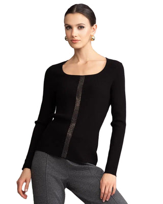 Woman wearing a black long-sleeve top with a gray pattern on a gray background