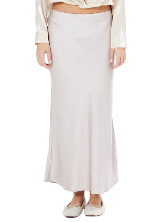 Person wearing a white skirt and blouse on a white background