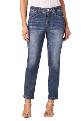 Person wearing blue jeans on a plain background