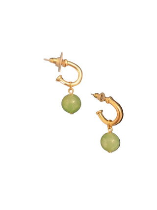 Gold hoop earrings with green beads on a black background