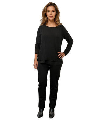 Woman wearing a black outfit on a white background