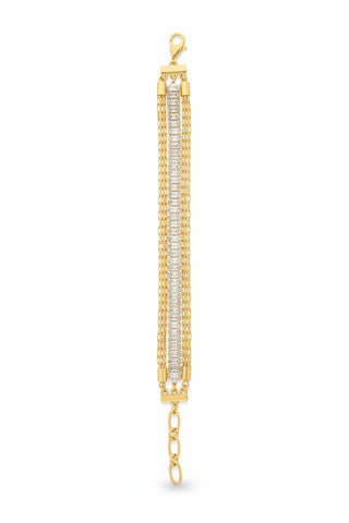 Gold bracelet with crystals on a textured surface