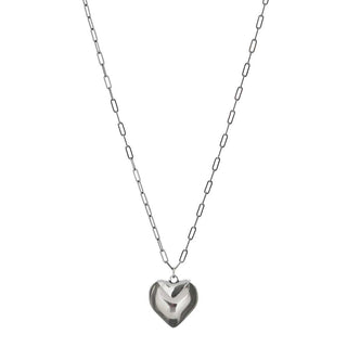 Silver heart-shaped pendant on a chain against a white background