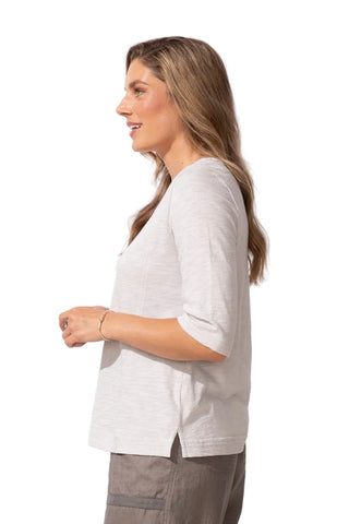 Woman wearing a light gray blouse with a white background