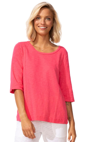 Woman wearing a pink top on a white background