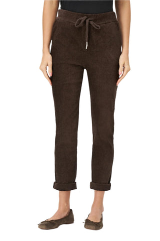 Brown pants worn by a person on a white background