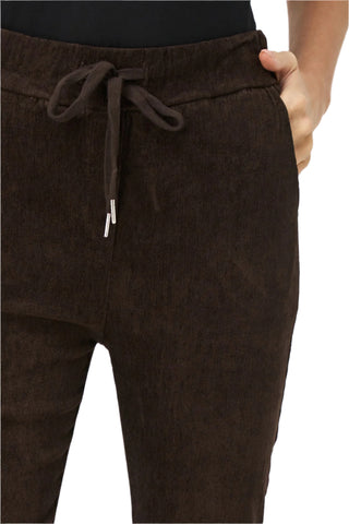 Brown corduroy pants with a drawstring on a white background