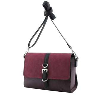 A rectangular shoulder bag with a maroon suede front flap and dark brown leather base, featuring a black adjustable strap and silver-tone buckle details, shown against a light gray background.