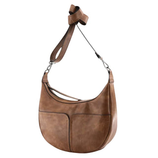 A brown leather crescent-shaped shoulder bag with a wide strap and silver-tone hardware, shown against a light gray background.