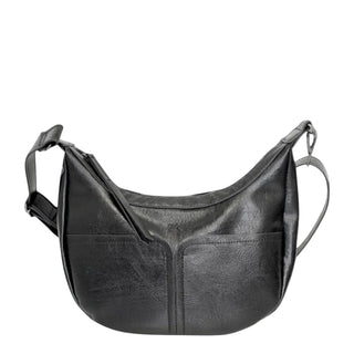 Black faux-leather crescent-shaped shoulder bag with a front zippered pocket and adjustable shoulder strap, shown against a light gray background.
