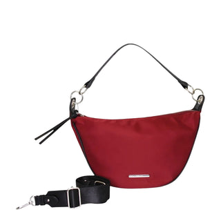 A red crescent-shaped nylon shoulder bag with black trim, a black shoulder strap, and a separate detachable black strap laid out in front, set against a light gray background.