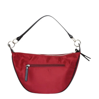 A red nylon crescent-shaped shoulder bag with black trim, a front zippered pocket, and a thin black shoulder strap with silver-tone hardware, shown against a light gray background.