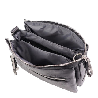 A dark gray leather crossbody bag shown open to display its interior compartments, including a main zippered compartment, a vertical divider, and a smaller zippered pocket. The bag features silver-tone metal zippers and hardware, photographed against a solid light gray background.