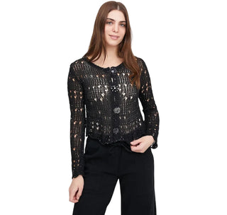 Woman wearing a black lace top on a white background