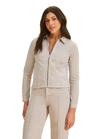 Woman wearing a light gray jacket and pants on a beige background