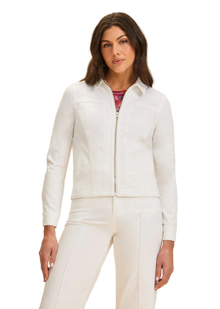 Woman wearing a white zip-up jacket and pants on a beige background