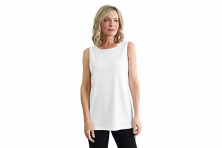 Woman wearing a black sleeveless top against a white background