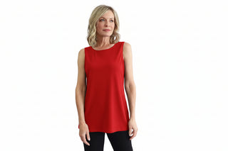 Woman wearing a black sleeveless top against a white background
