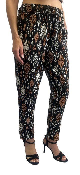 Patterned pants worn by a person on a white background