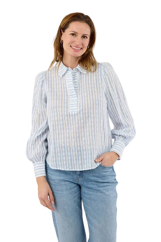 Woman wearing a striped shirt and jeans on a white background