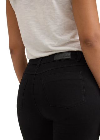 Close-up back view of a person wearing black high-waisted skinny jeans and a light heather gray sleeveless top, showing the back pocket and waistband.