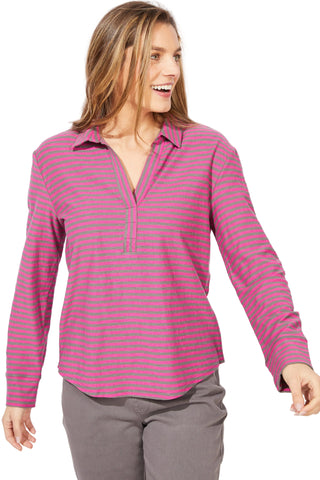 Woman wearing a pink and gray striped shirt against a white background