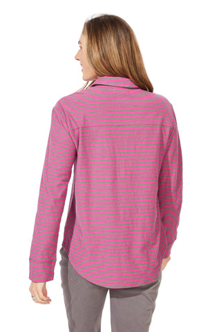 Woman wearing a pink striped shirt against a white background