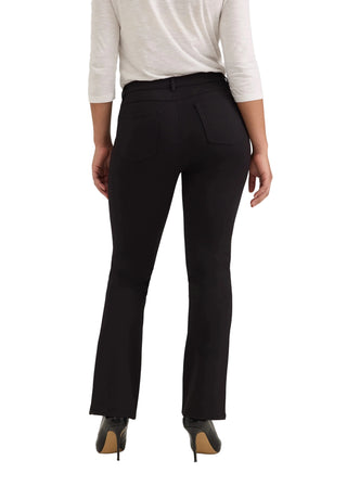 A model shown from the back wearing black high-waisted flared trousers, a white long-sleeve top, and black high-heeled shoes against a light gray studio background.