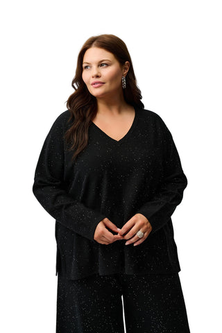 Woman wearing a black dress against a white background