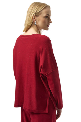 Woman wearing a red outfit against a white background