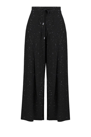 Black wide-leg pants with subtle pattern on a light gray background