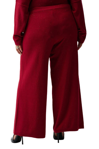 Red outfit with wide-leg pants on a white background
