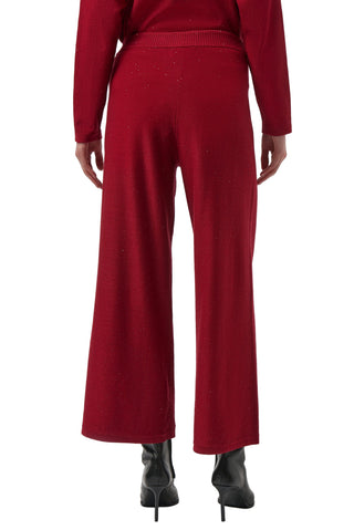 Red outfit with wide-leg pants and a matching top on a white background