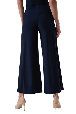 Navy wide-leg pants worn by a person on a white background