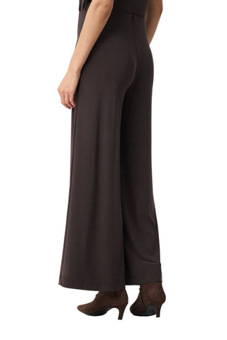 Brown jumpsuit worn by a person on a white background