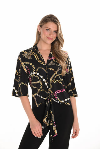 Woman wearing a black blouse with gold chain pattern on a white background