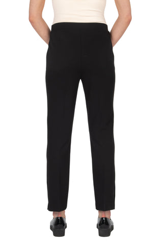 Black pants worn by a person on a white background