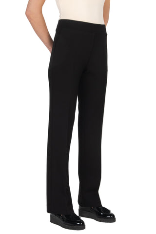 Black pants worn by a person on a white background