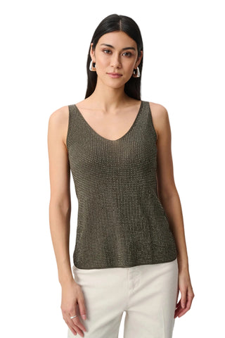Woman wearing a patterned tank top against a white background