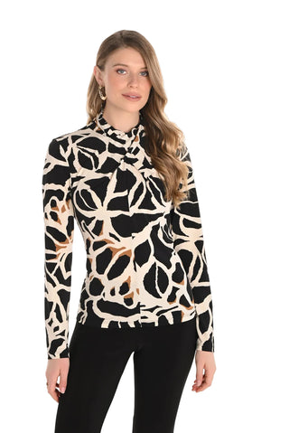Woman wearing a black and beige patterned blouse on a white background
