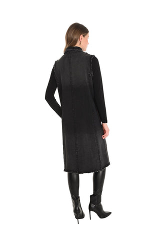 Woman wearing a black coat on a white background