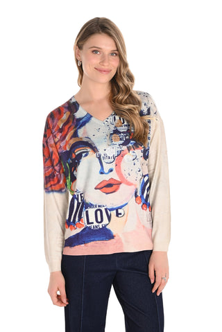 Woman wearing a colorful graphic sweater with abstract design on a white background