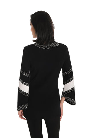 Black top with white and silver embellishments on a white background