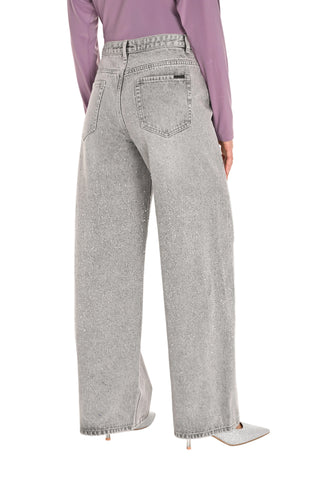 Gray wide-leg jeans worn by a person on a white background