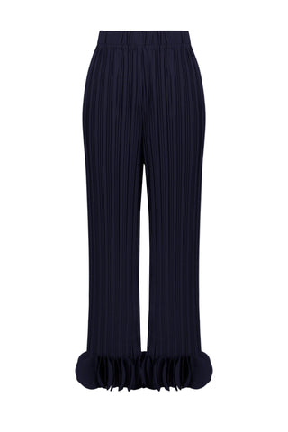Black pleated pants with ruffled hem on a white background