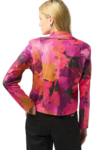 Woman wearing a colorful jacket with abstract patterns on a white background