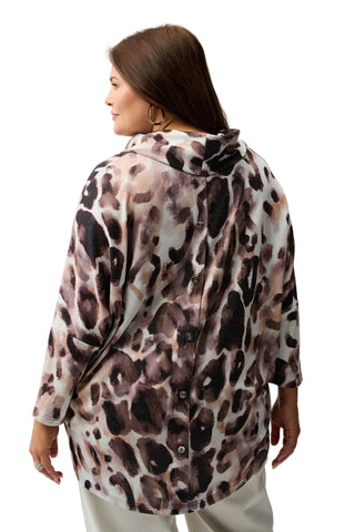 Woman wearing a leopard print jacket on a white background